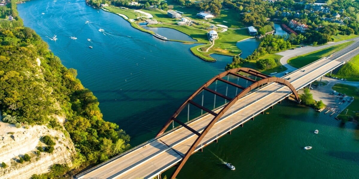 Aerial view of Lake Austin luxury neighborhoods showing waterfront estates and communities