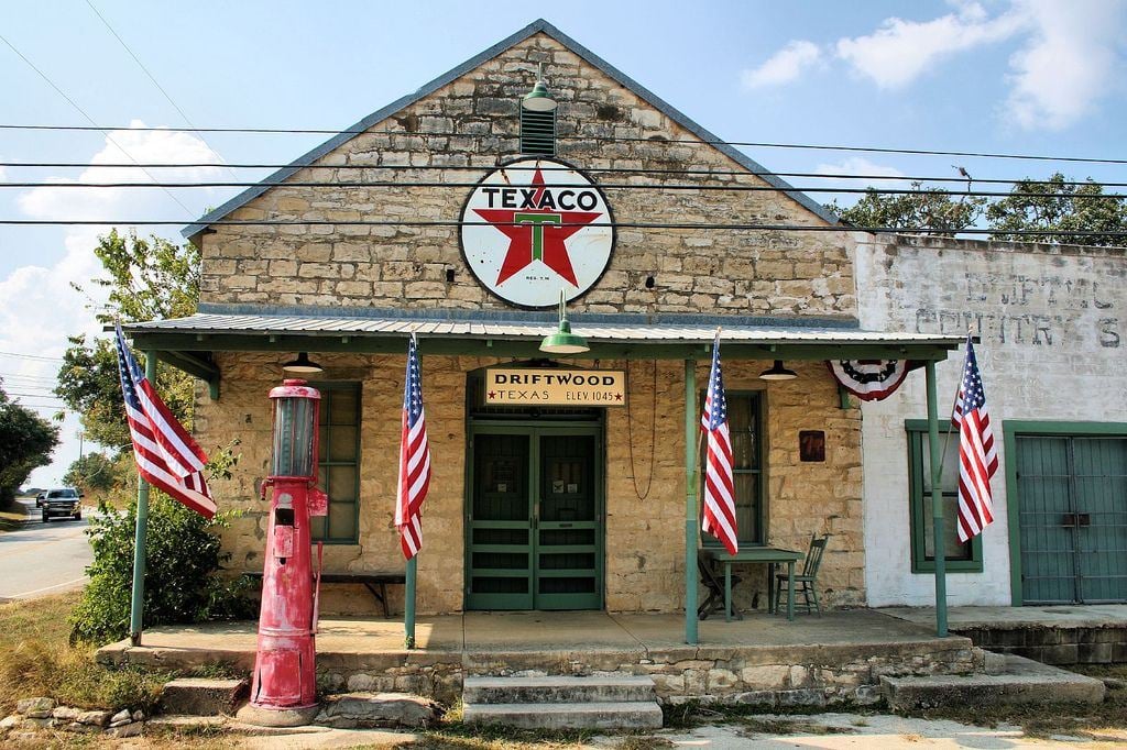 Historic Driftwood, Texas storefront with a Texaco sign and vintage red gas pump.