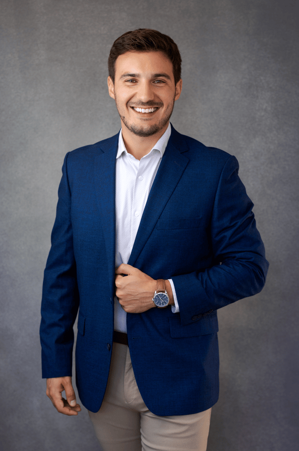Hunter Tedrick in a navy blazer and white shirt.