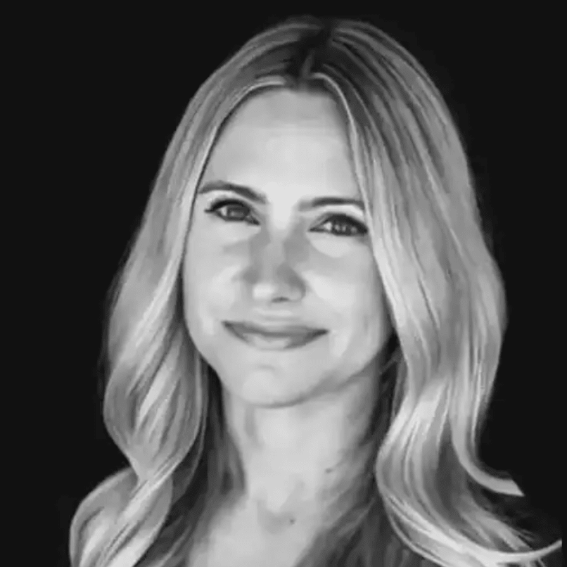 Crystal Ferris, smiling in a black-and-white headshot with long, light-colored hair.