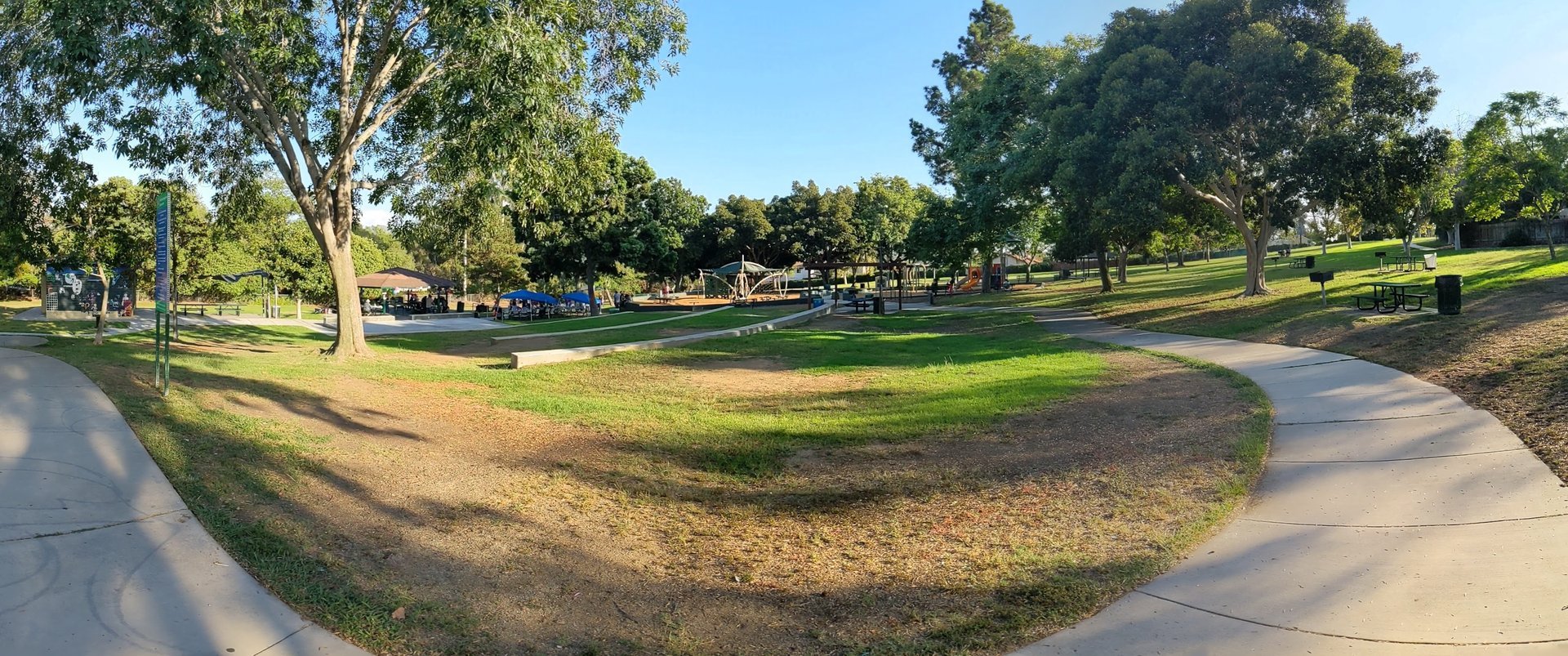 Lawn, shade trees and picnic shelter at Berry Street Park in western Lemon Grove
