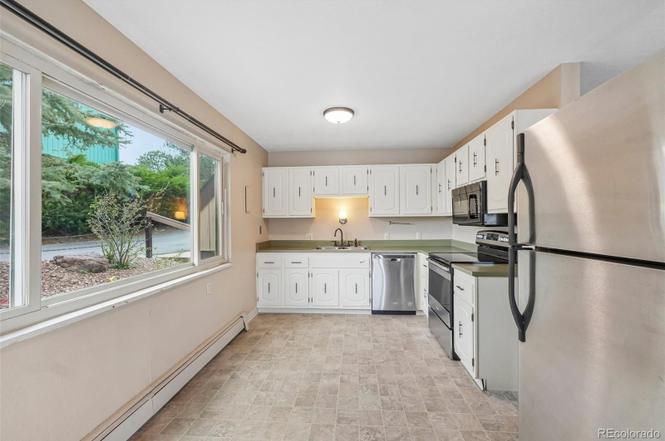 Lake Woodmoor Investor Special – Rare 1-Bed Lakeside Townhome with Huge Upside
