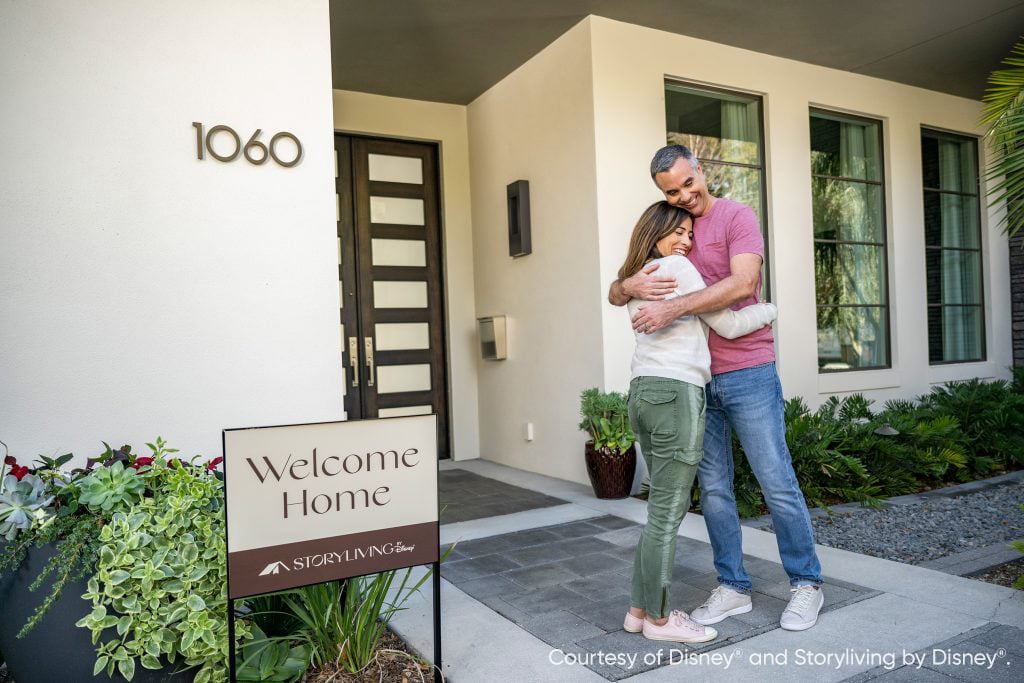 couple in front of house