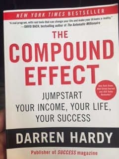 The Compound Effect by Darren Hardy, with a red-and-white cover.