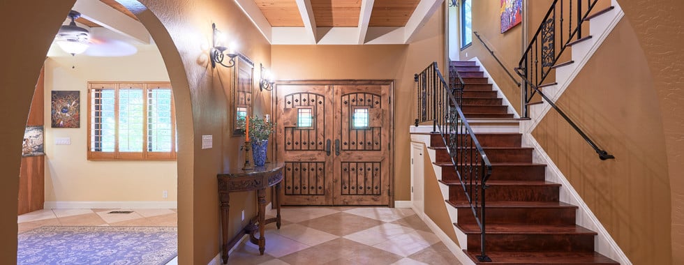 Grand is the best word to describe this architecturally stunning Spanish style home