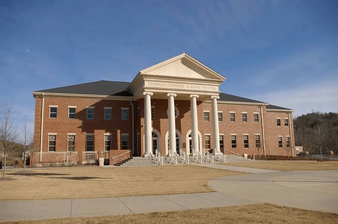 Lumpkin County Justice Center with a columned entrance and red-brick facade.