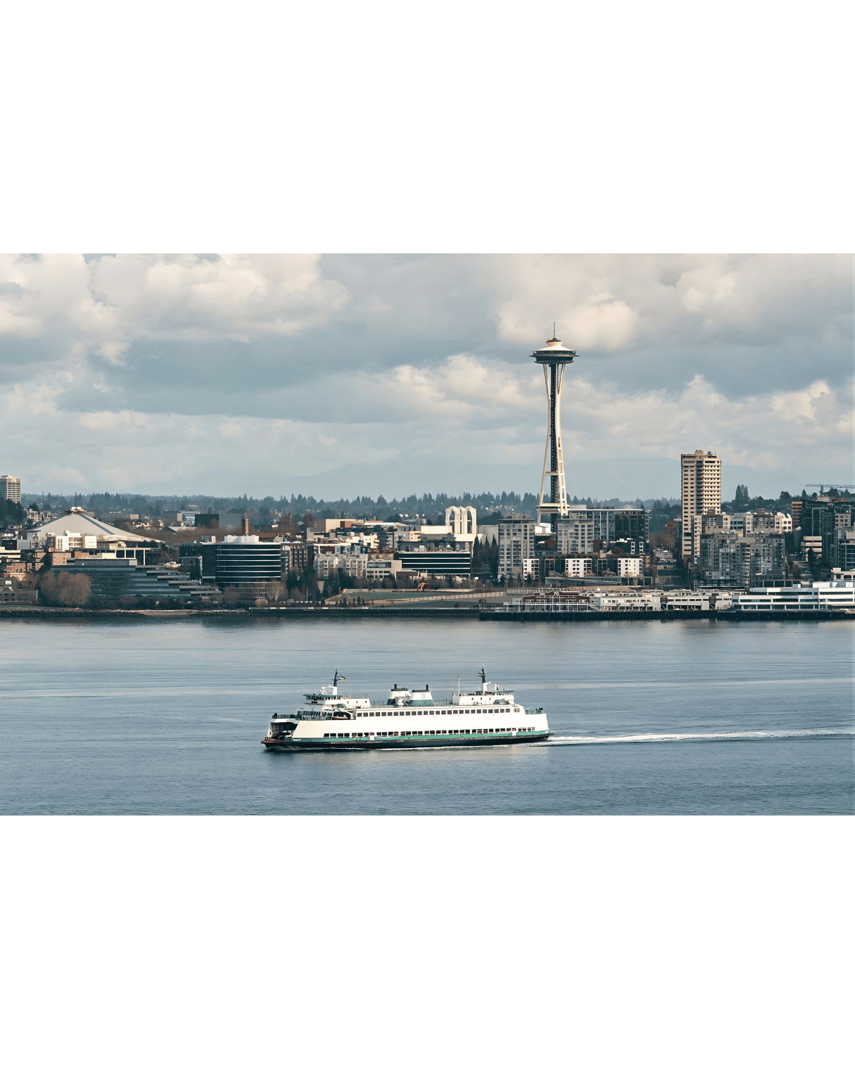 Port Orchard Ferry sailing on the water near the Seattle Space Needle