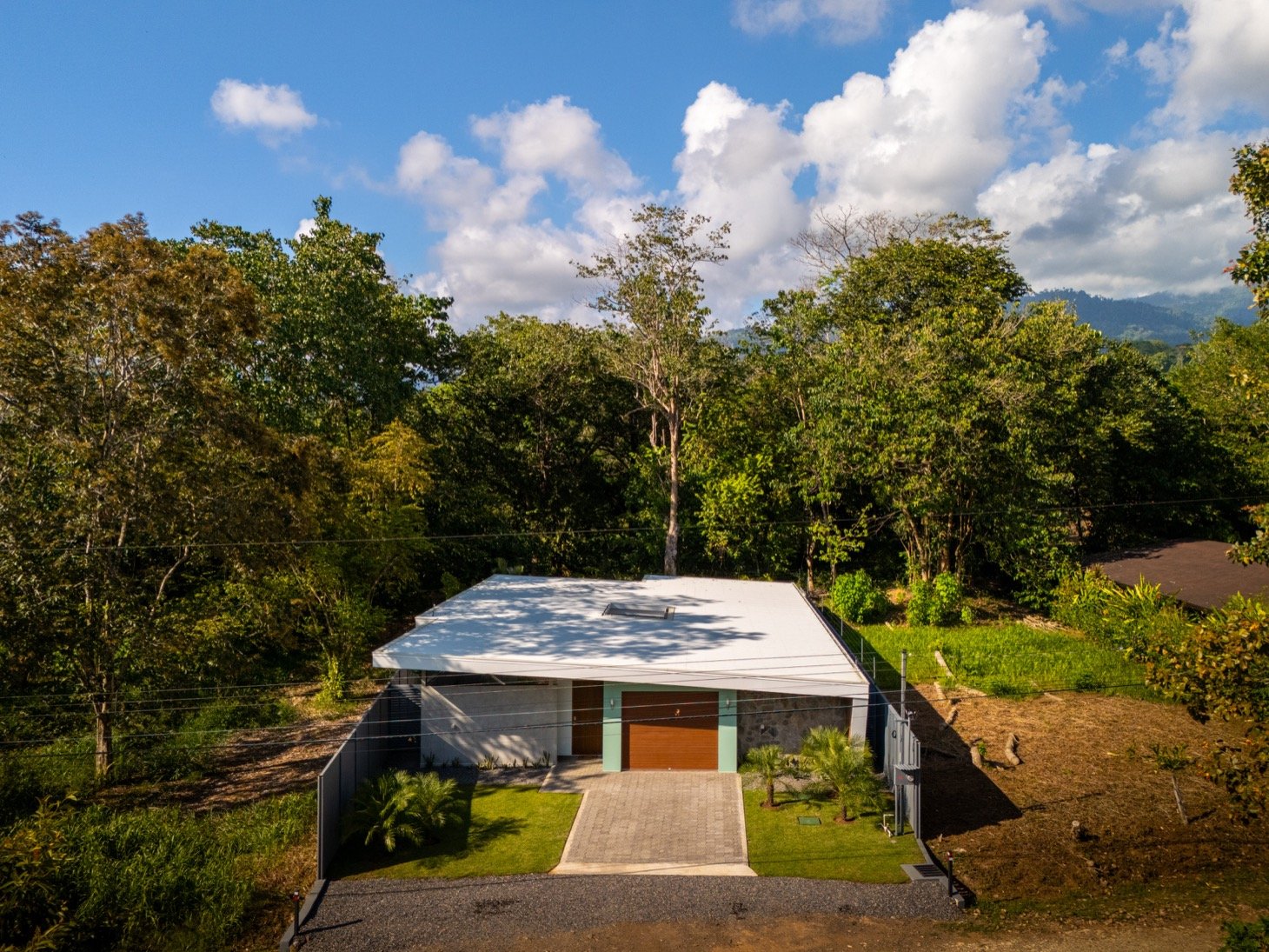 Stunning 3-Bedroom, 2.5-Bathroom Tropical Mid-Century Modern Home – Steps from the Beach