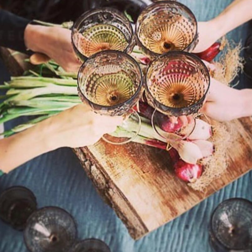 People toasting with wine glasses