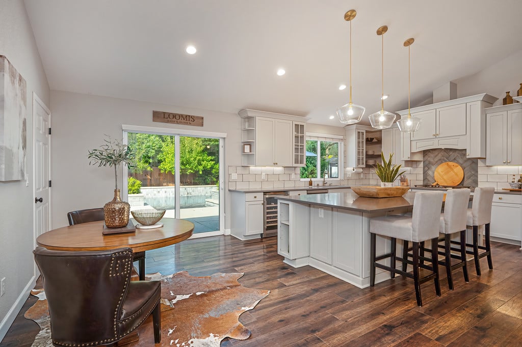 Kitchen with a large island and sliding glass doors opening to the backyard.