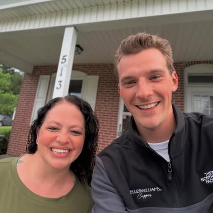 Aaron with a client outside a home