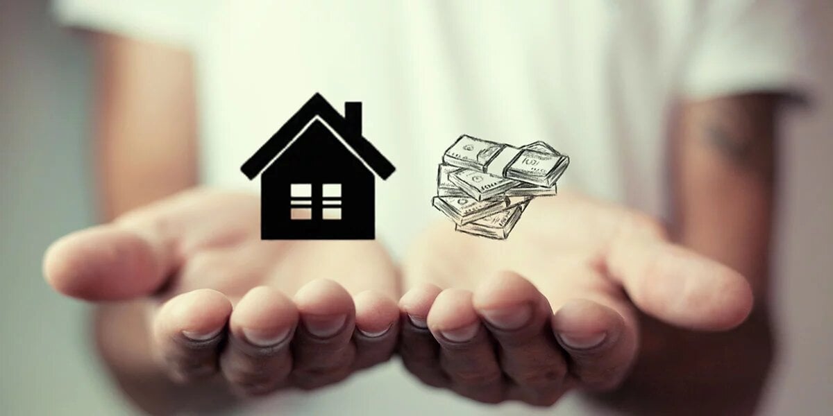 Open hands hold a house symbol and bundled cash.