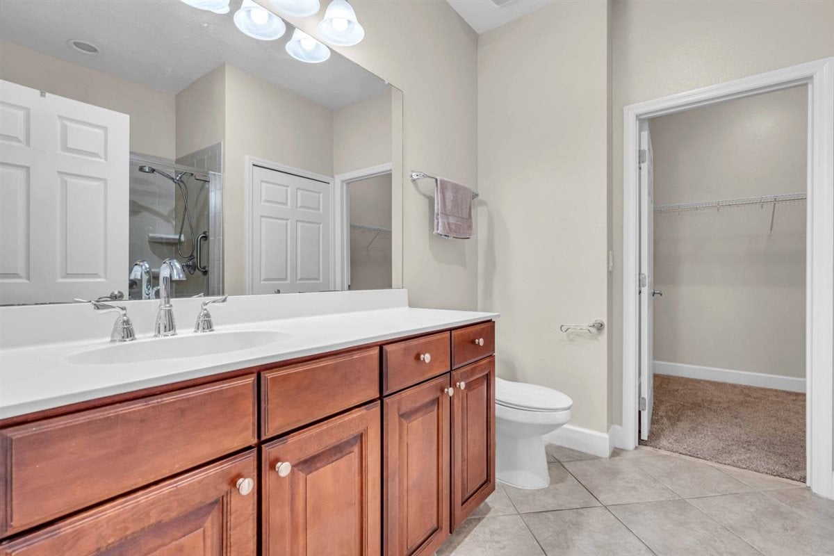 Primary bathroom with a spacious walk-in closet