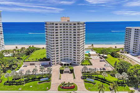 Oceanfront condominiums with landscaped grounds and the Atlantic Ocean beyond.