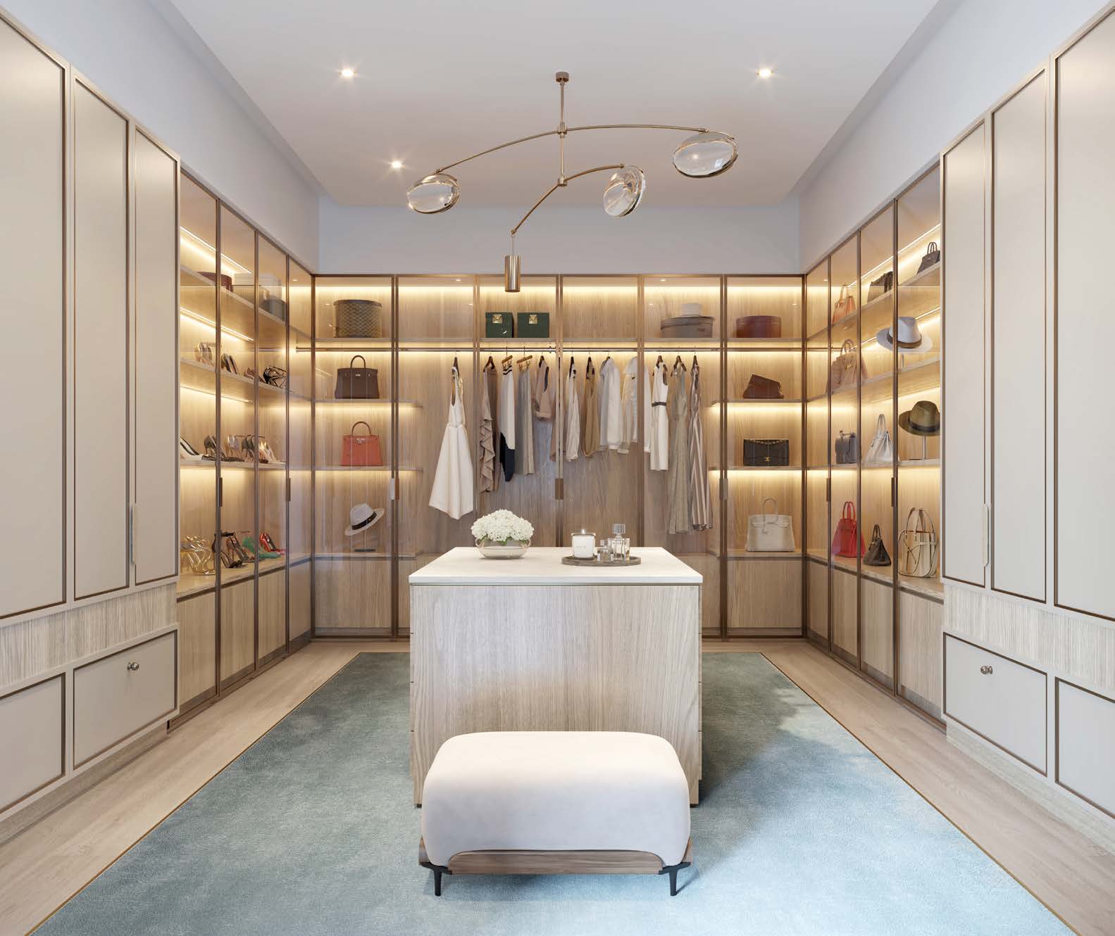 Rendering of a walk-in closet with a center island at Olana Naples Residences