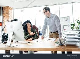 Professional business collaboration in a modern luxury real estate office, representing the concierge connection for high-end referrals in Northern California.