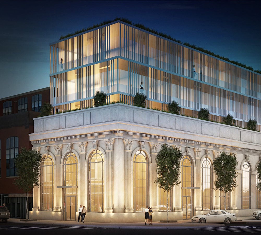 Architectural rendering of a modern glass addition above an ornate historic facade, illuminated at night.