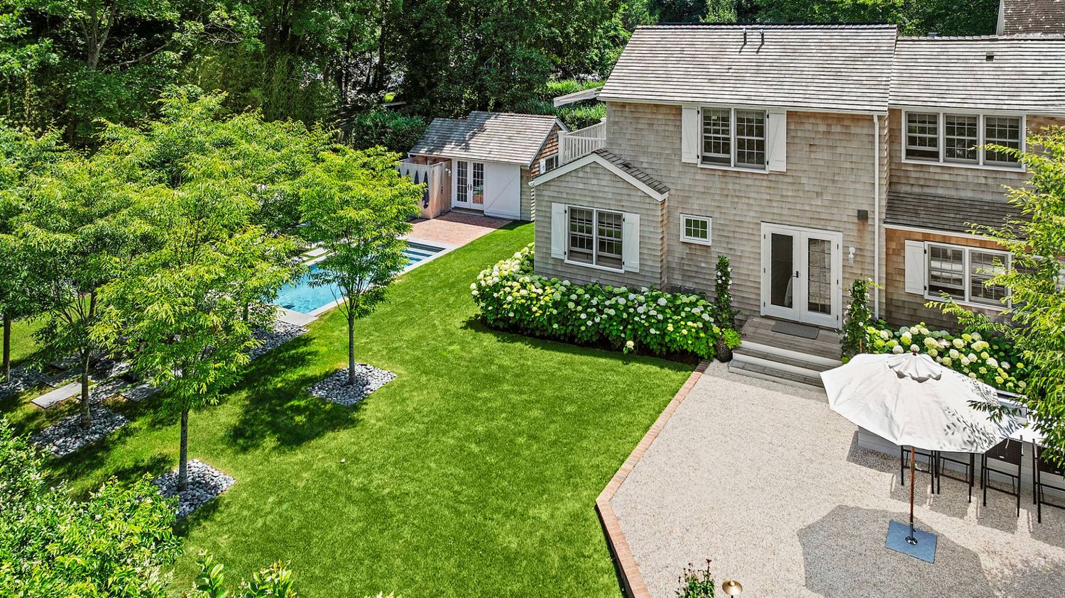 Modernized Vintage Cottage with Knockout Backyard, Moments to Village Main