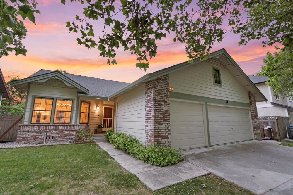 Exterior view of Petaluma home featuring spacious three-bay garage