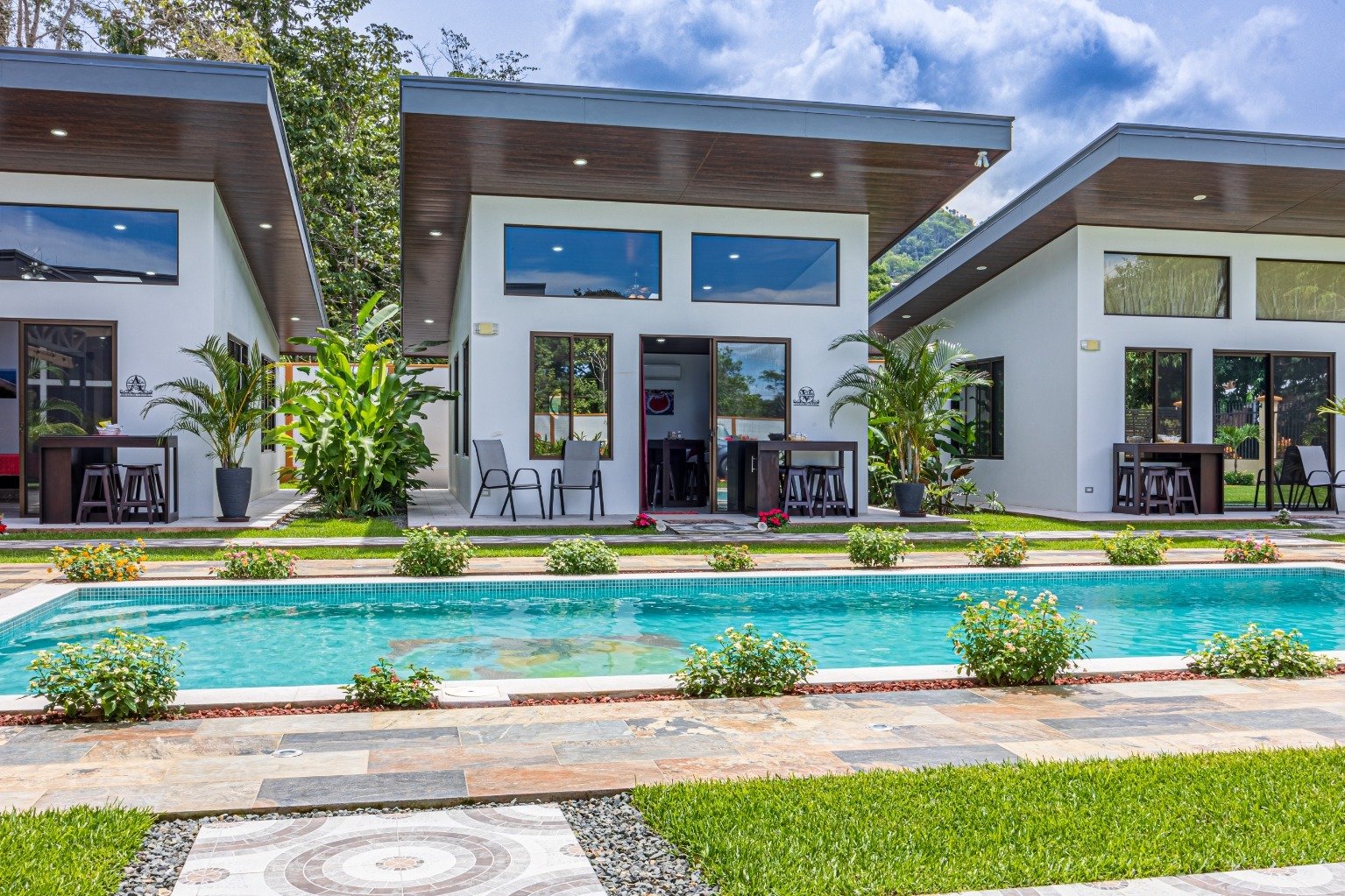 Incredible turnkey investment opportunity, 3 Rental villas, and a 2 Bedroom Home with a large pool.