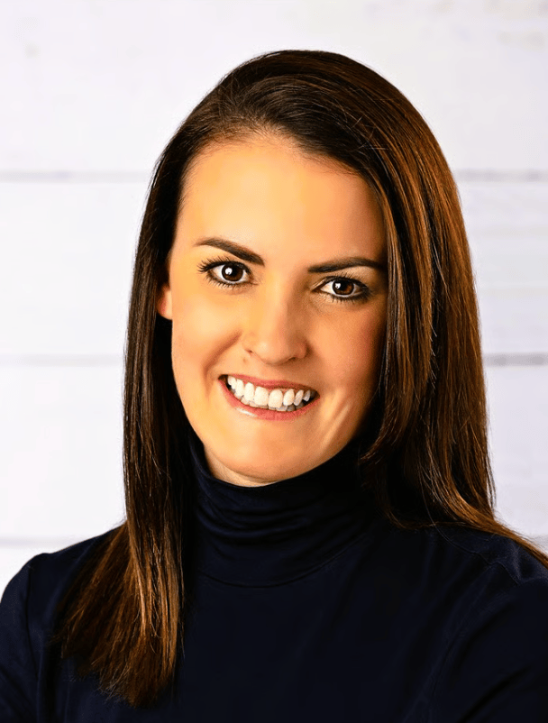 Nori Siemers smiling in a black turtleneck