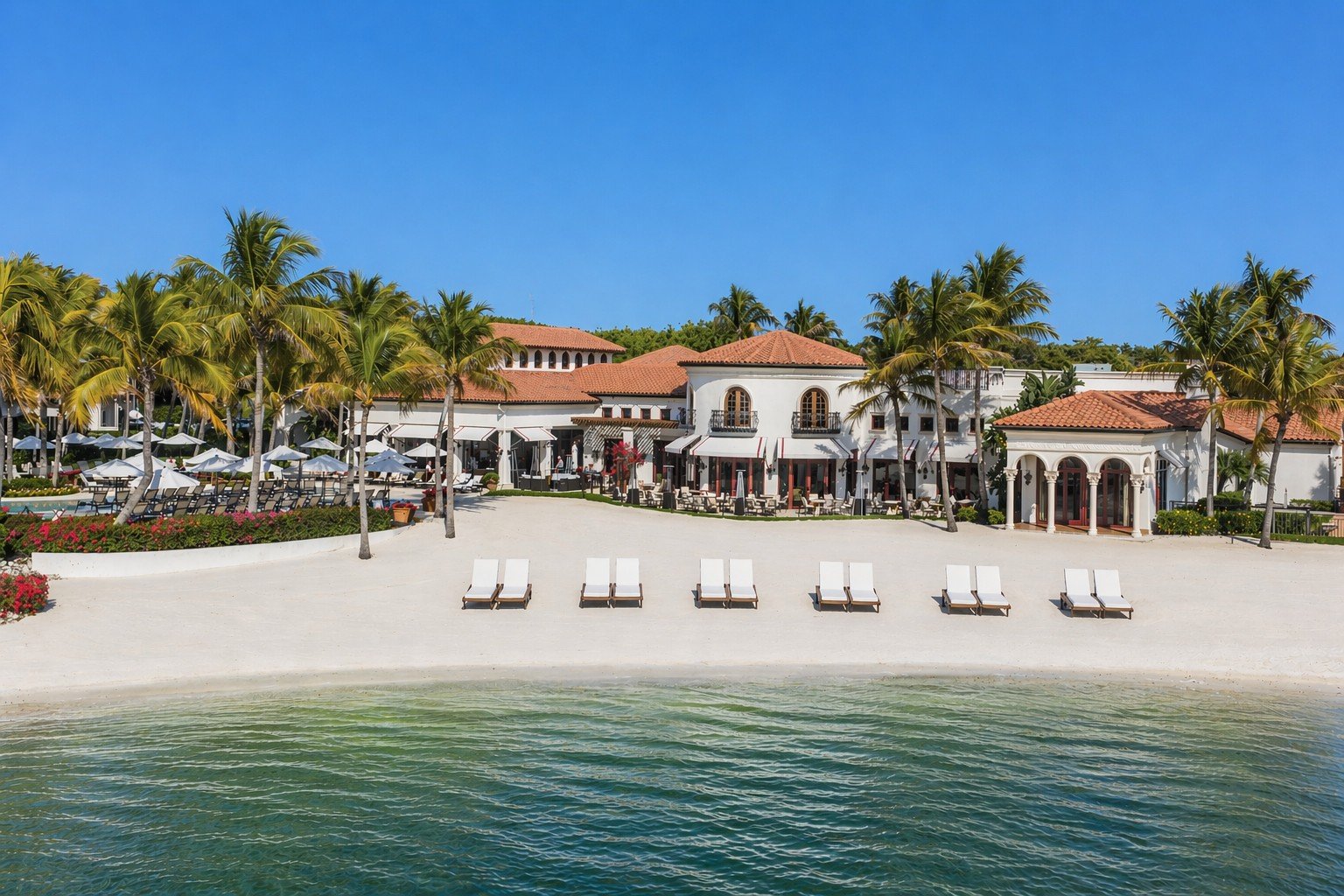 The private beach and Beach Clubhouse on Lake Como at Miromar Lakes Beach & Golf Club