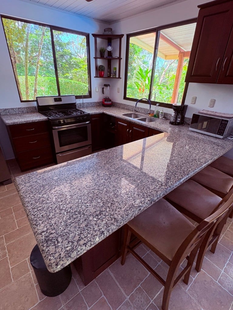 Move in ready 2 bedroom / 2 bathroom home with window ocean view and pool in Ojochal.