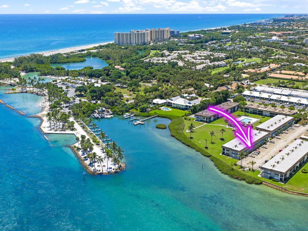 Waterfront pool and dock at a 55+ seasonal rental community on the Jupiter Inlet