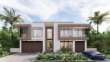 Modern two-story home with two garage doors, palm trees, and cars in the driveway.