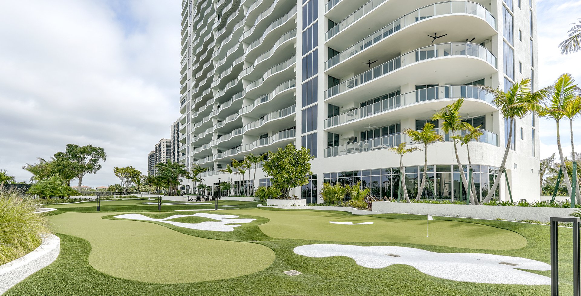Infinity at The Colony tower above its putting course in Bonita Springs