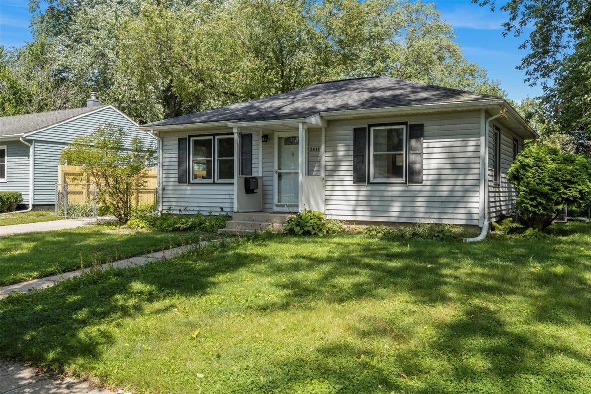 A well-maintained single-family home in Madison representing the choice between accepting a direct cash offer and listing on the open market.