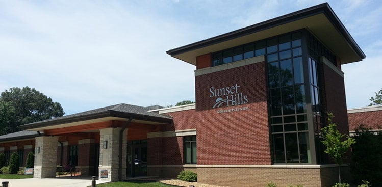 Sunset Hills Community Center, a brick building with a glass tower and covered entrance.