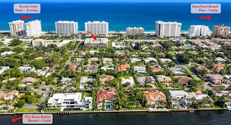 Aerial view of East Boca Raton homes between the ocean and a waterway, with nearby landmarks labeled.