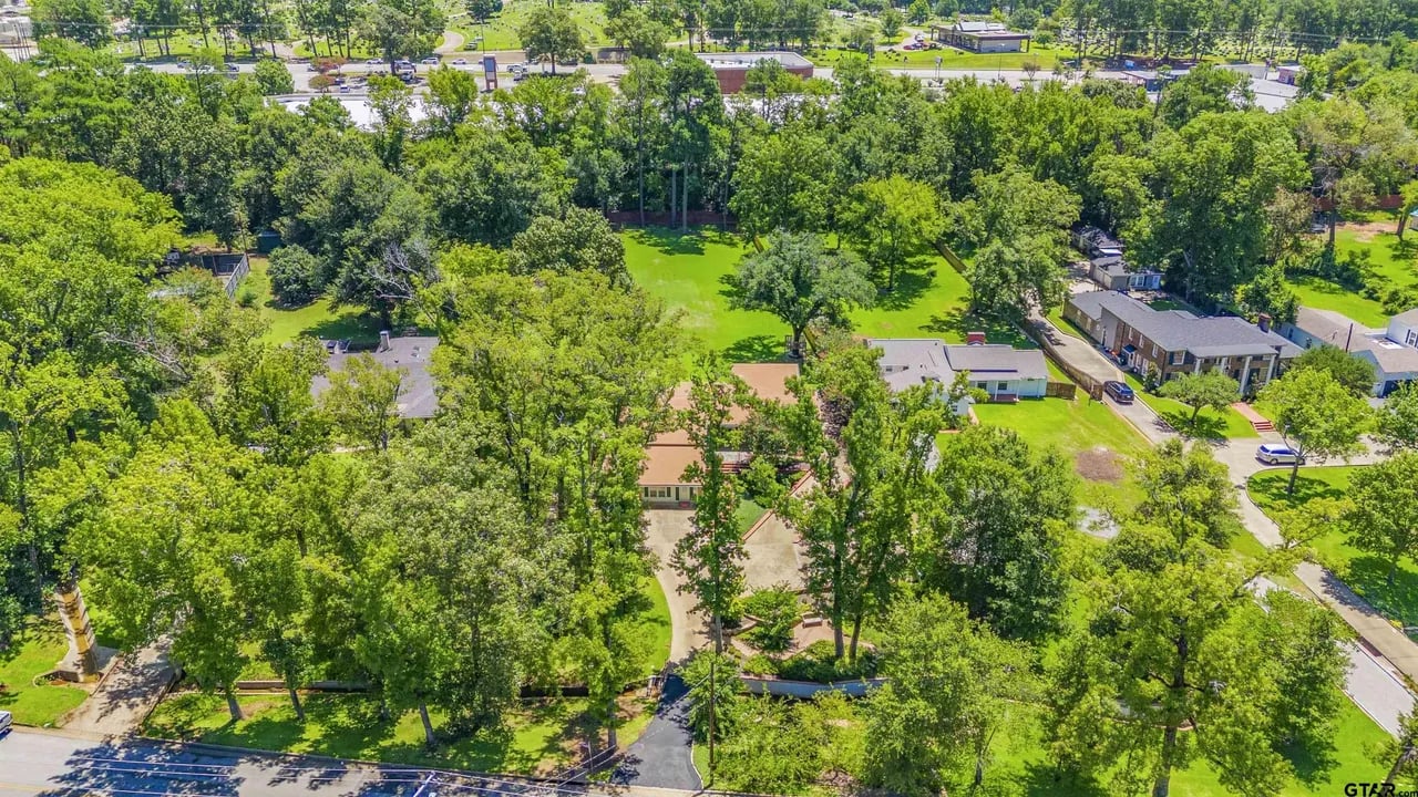 Overhead picture of house with lots of trees and greenery