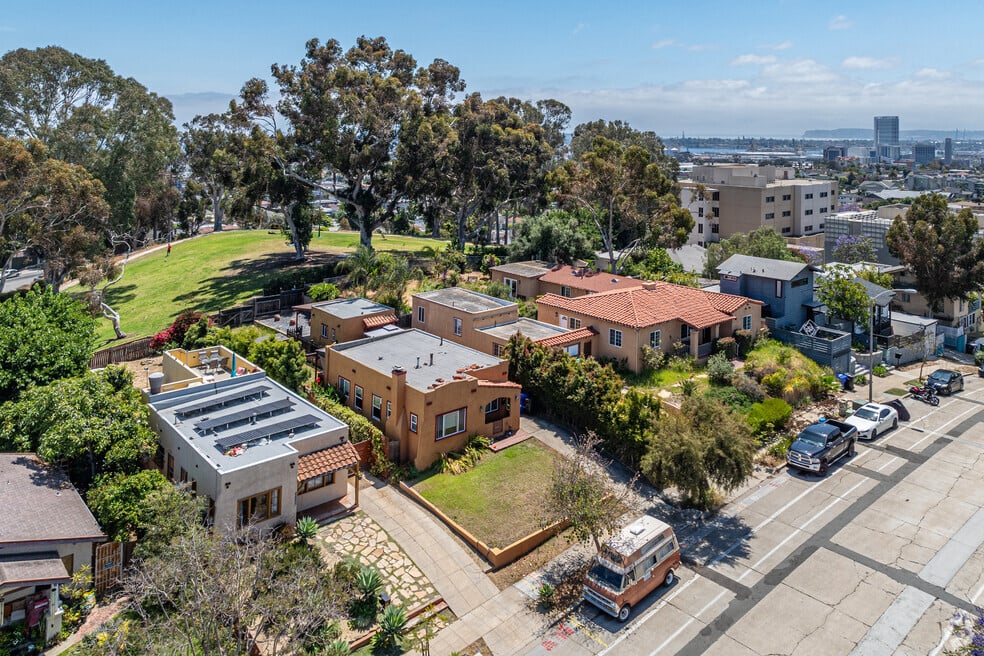 Aerial view of Grant Hill, San Diego showing early 20th-century homes, tree-lined streets, and nearby downtown skyline, highlighting the neighborhood’s charm and central location.
