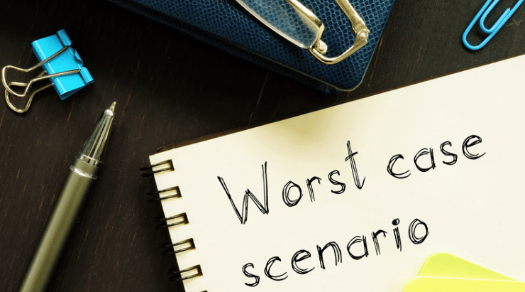 Notebook handwritten with “Worst case scenario” beside a pen and blue binder clips.