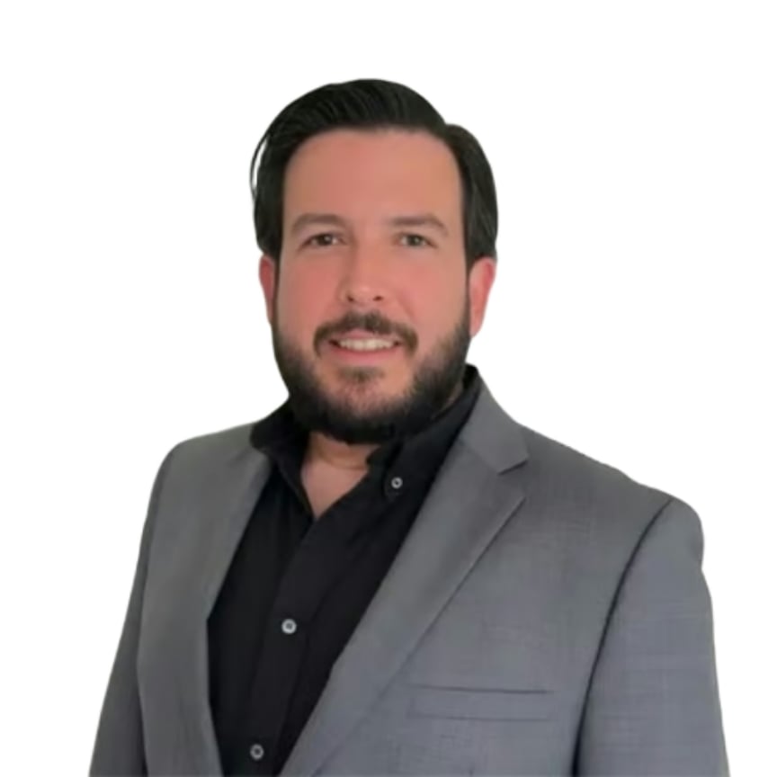 Pedro Bello Lorie wearing a gray blazer and black shirt.