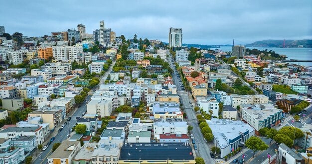 Golden Gate Bridge view from a residential area, implying new beginnings.