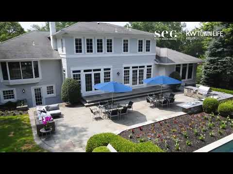Exquisite Hamptons-style home on a +/- 1.1-acre property on the exclusive east hill of Tenafly