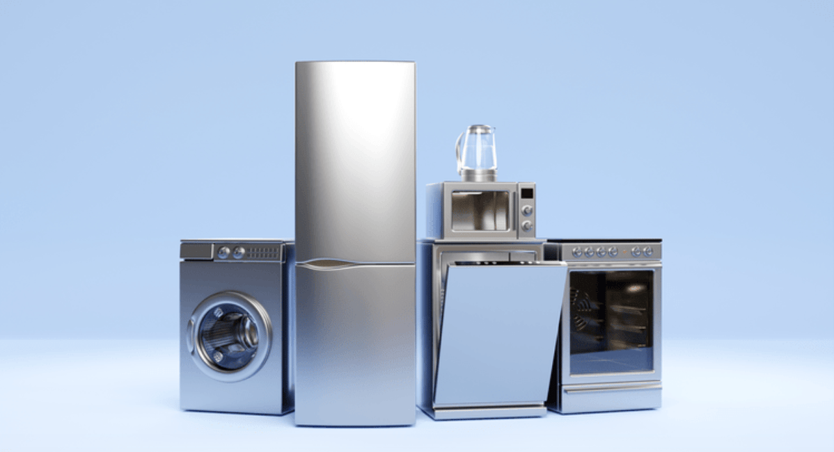 Stainless steel refrigerator, washing machine, dishwasher, microwave, and oven arranged in a lineup.