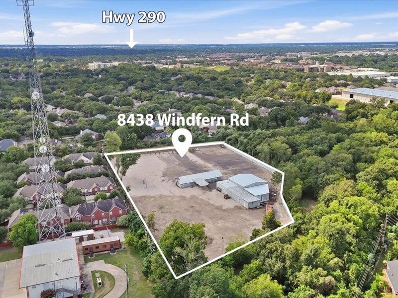 Aerial view of the outlined Windfern Road property, with low-rise buildings amid dense trees.