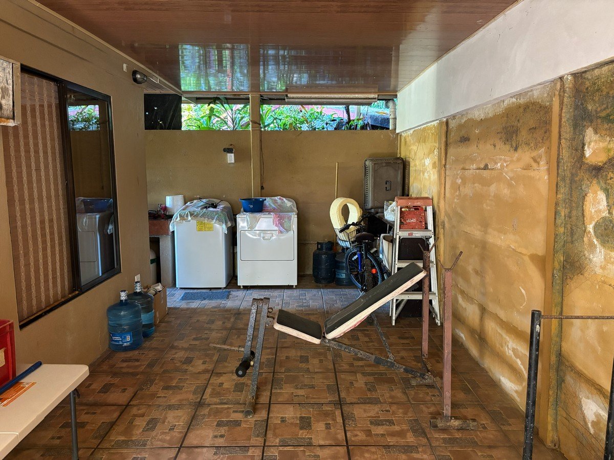 0.16 Acres – 4 Living Units, 7 Bedroom Riverfront Investment Package Near Dominical Beach With Owner Financing!!!