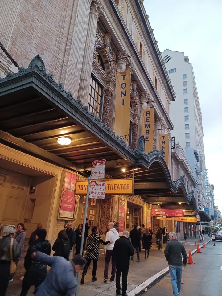 Crowd gathering under the marquee of the historic Toni Rembe Theater in San Francisco before a show.
