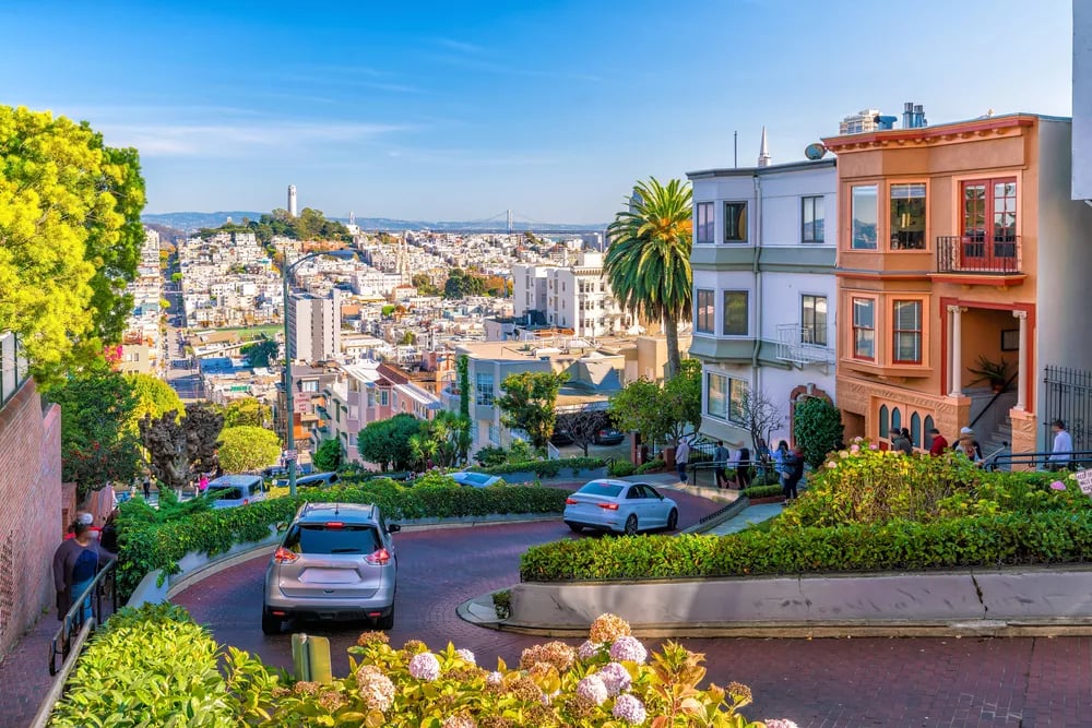 San Francisco neighborhood with colorful homes and a steep, curving street.