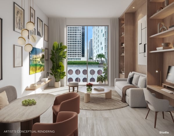 Staged Viceroy Brickell living room with city views, built-in shelving, and a dining area.