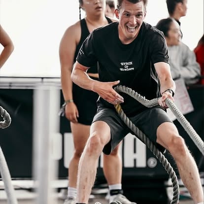 Aaron training with battle ropes