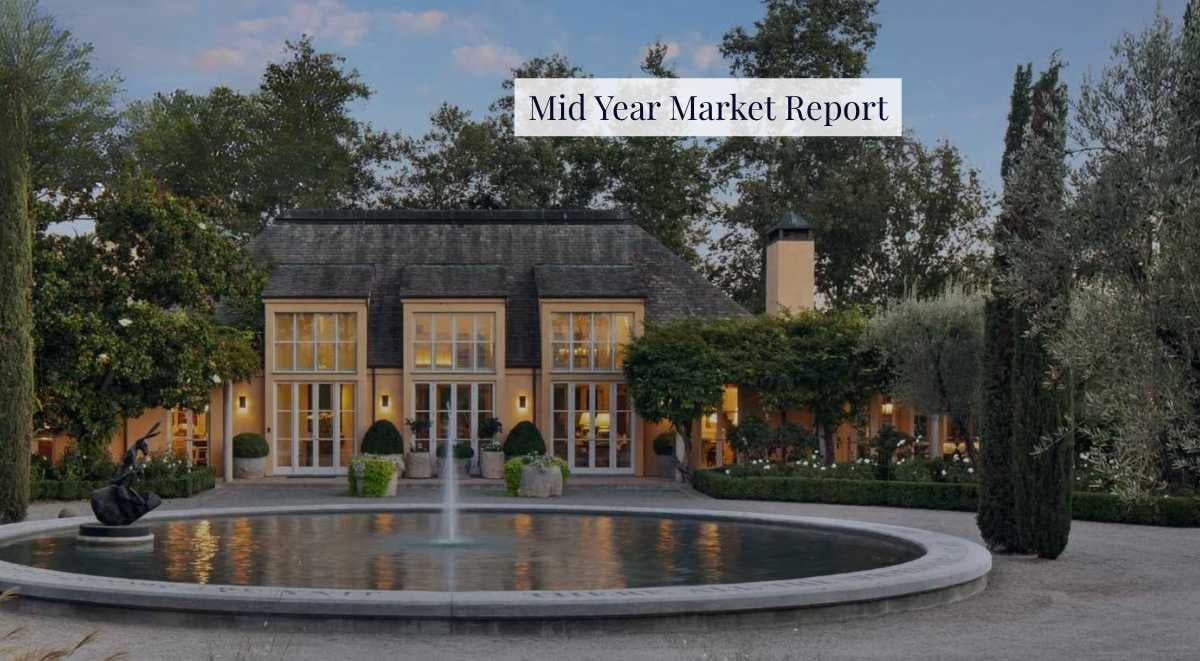 Luxury estate with fountain at sunset featured on the 2025 Mid-Year Luxury Outlook report cover by Sotheby’s International Realty