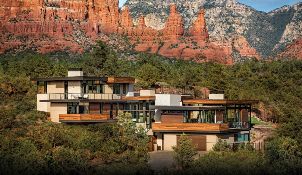 Modern glass-walled home and historic adobe home in Sedona