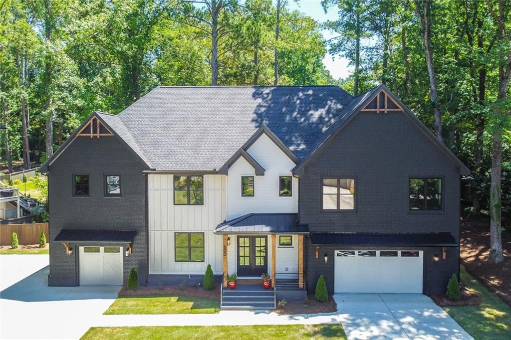 Front exterior of Ridgewater Bleu luxury home in Marietta GA, featuring elegant landscaping and located in the prestigious East Cobb area near Walton High School.