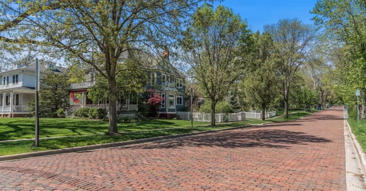 Historic brick-paved residential street in the Prince Pond neighborhood of Downers Grove, Illinois, reflecting the area's architectural heritage and established character.